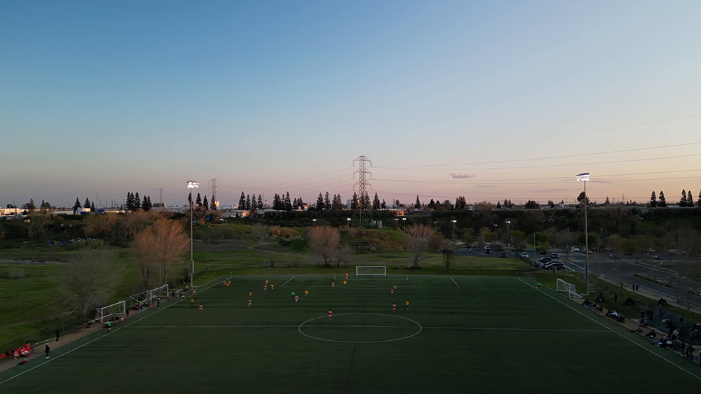 Drone shot of a football pitch with players in action